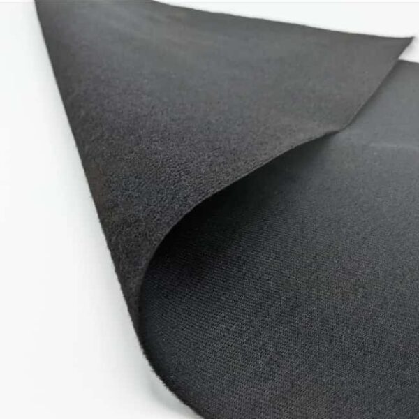 Black fabric sheet with one corner folded back, revealing a softer, textured underside.
