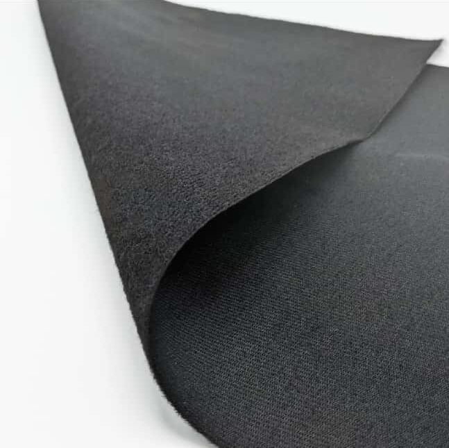 Black fabric sheet with one corner folded back, revealing a softer, textured underside.